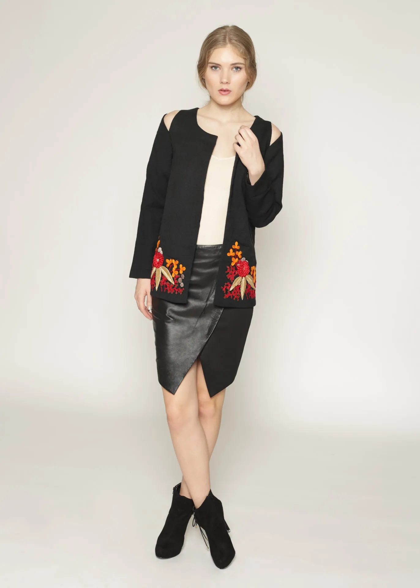 Wool jacket with cutout shoulders and embroidery details